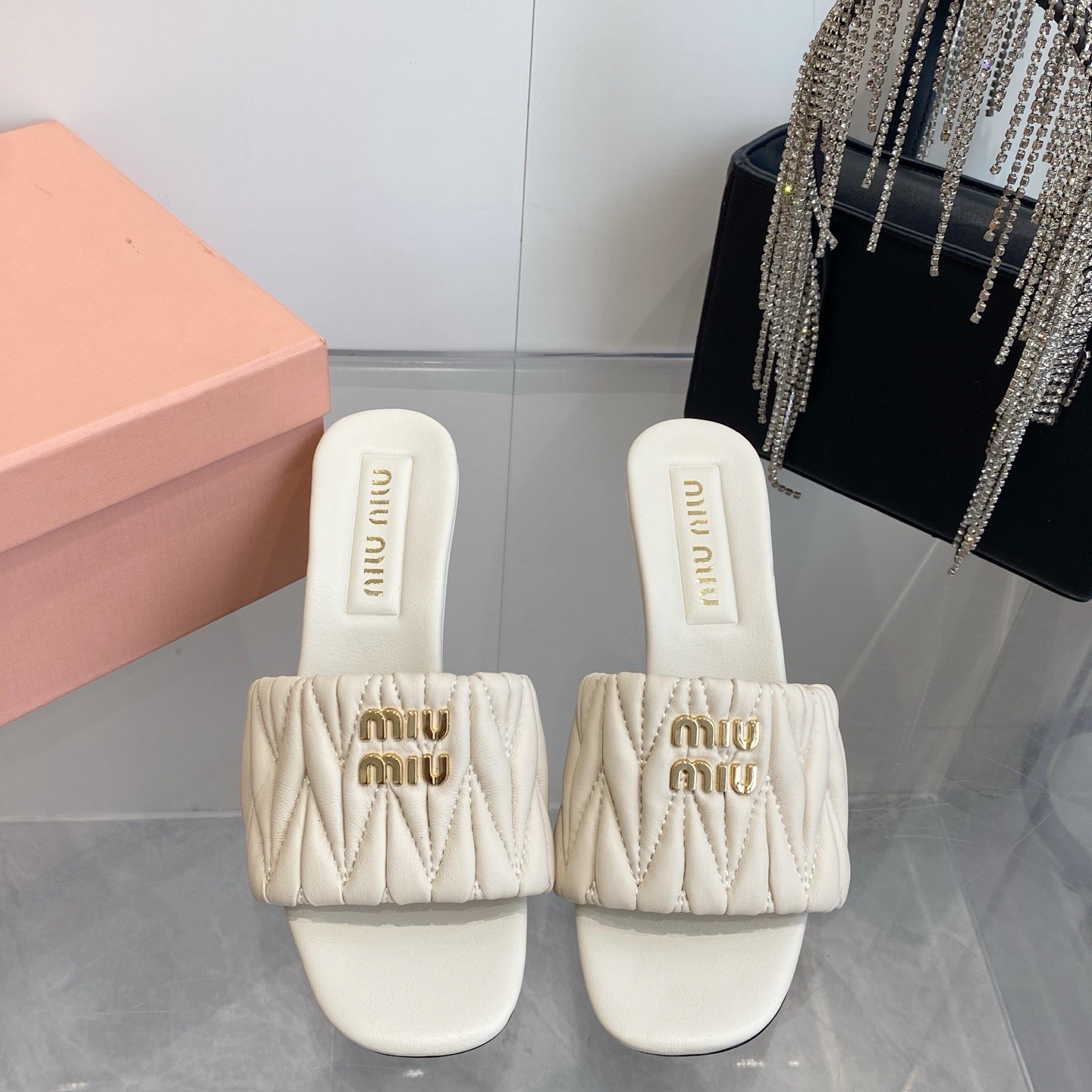 Miu Miu Quilted Flat Sandals in Genuine Lambskin with Metal Logo Calfskin Lining Italian Leather Sol